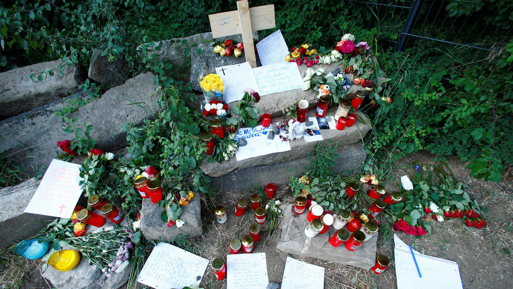 Messages of mourning, candles and flowers are placed by people for Susanna F., the teenager who was found dead two days ago, in Wiesbaden-Erbenheim, Germany, June 8, 2018. REUTERS/Ralph Orlowski
