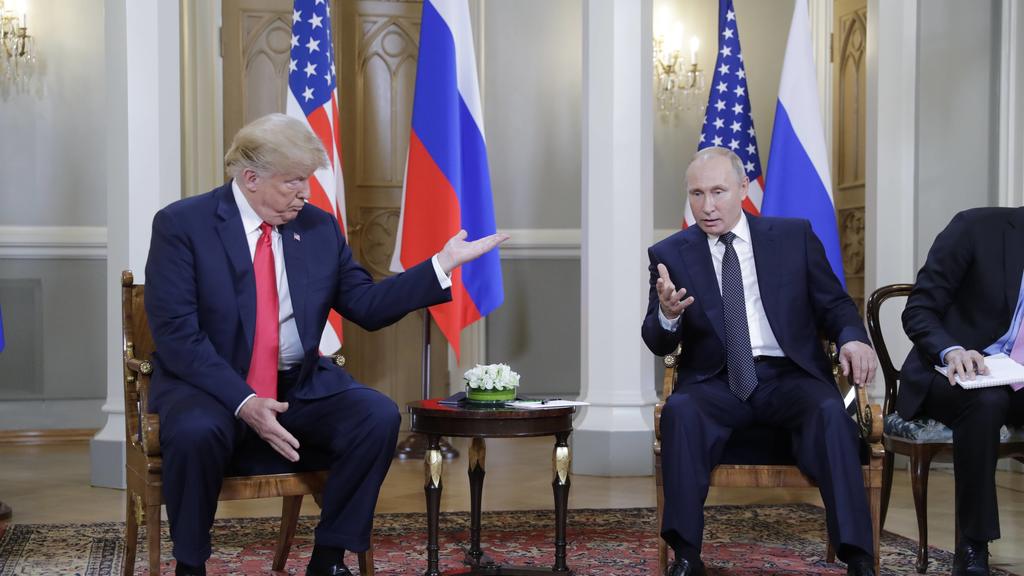 HELSINKI, FINLAND - JULY 16, 2018: US President Donald Trump (L) and Russia s President Vladimir Putin talk during a meeting at the Presidential Palace. Mikhail Metzel/TASS PUBLICATIONxINxGERxAUTxONLY TS089CA7