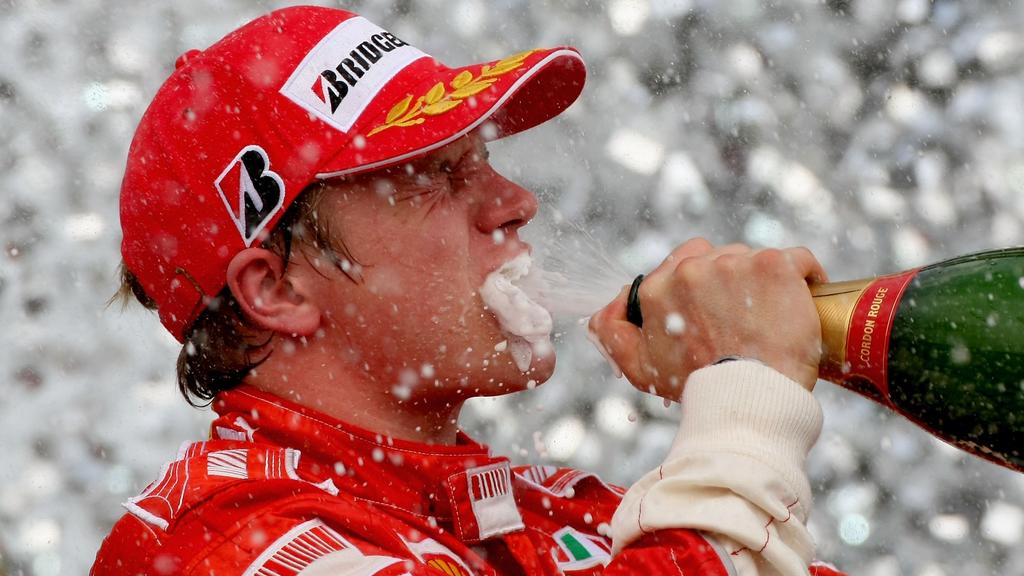 SAO PAULO, BRAZIL - OCTOBER 21: Kimi Raikkonen of Finland and Ferrari celebrates on the podium after winning the race and the F1 World Championship at the Brazilian Formula One Grand Prix at the Autodromo Interlagos on October 21, 2007 in Sao Paulo,