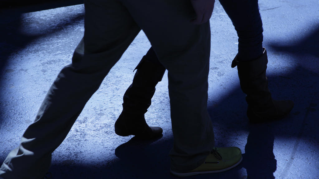 "Concept: male following female in the dark night, a stalker"