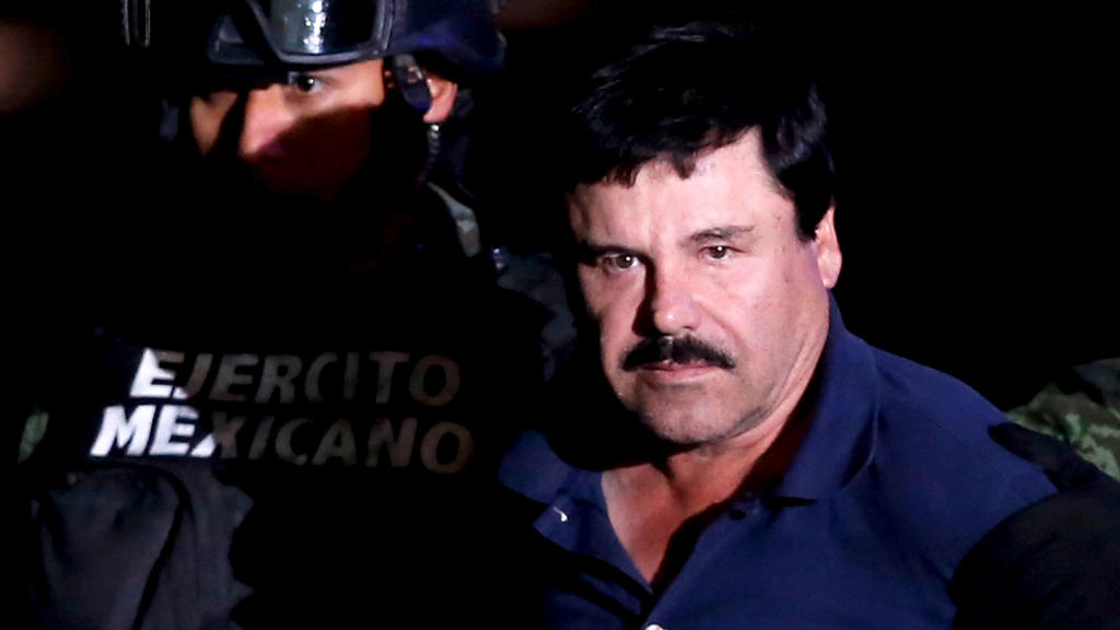 FILE PHOTO: Joaquin "El Chapo" Guzman is escorted by soldiers during a presentation at the hangar belonging to the office of the Attorney General in Mexico City, Mexico January 8, 2016. REUTERS/Edgard Garrido/File Photo