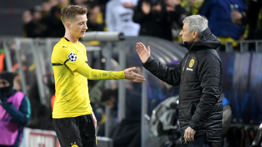 05.03.2019, Nordrhein-Westfalen, Dortmund: Fußball: Champions League, Achtelfinale, Rückspiel, Borussia Dortmund - Tottenham Hotspur im Signal Iduna Park. Dortmunds Trainer Lucien Favre bedankt sich bei Marco Reus (l) nach dessen Auswechslung. Foto:
