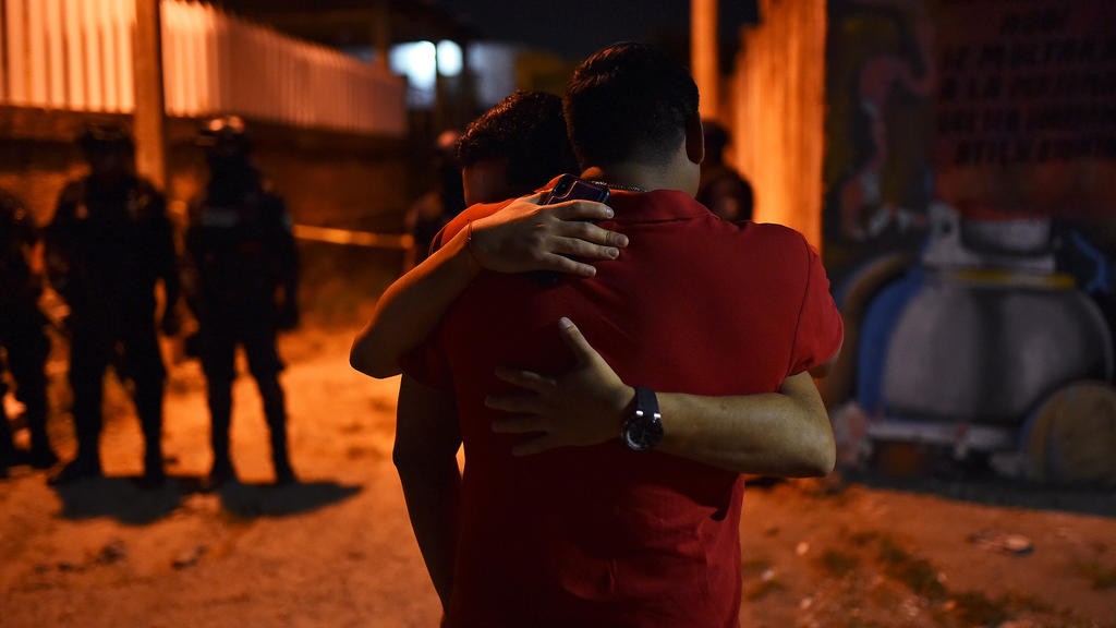 People react at a crime scene where unidentified assailants opened fire at a bar in Minatitlan, in Veracruz state, Mexico, April 19, 2019. Picture taken April 19, 2019. REUTERS/Angel Hernandez NO RESALES. NO ARCHIVES