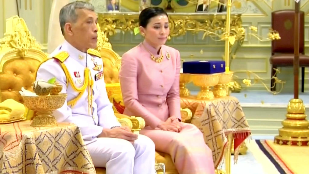 King Maha Vajiralongkorn and his consort, General Suthida Vajiralongkorn named Queen Suthida attend their wedding ceremony in Bangkok, Thailand May 1, 2019, in this screen grab taken from a video. Thai TV Pool THAILAND OUT. NO COMMERCIAL OR EDITORIA