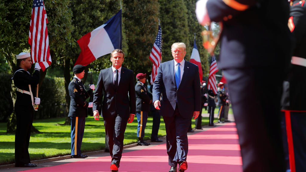 U.S President Donald Trump and French President Emmanuel Macron attend a French-American commemoration ceremony for the 75th anniversary of D-Day at the American cemetery of Colleville-sur-Mer in Normandy, France, June 6, 2019.