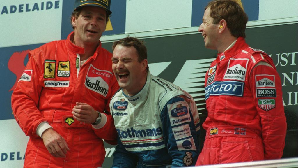 13 NOV 1994: LEFT TO RIGHT: SECOND PLACE FINISHER, FERRARI's GERHARD BERGER, WINNER, NIGEL MANSELL AND MARTIN BRUNDLE, THE THIRD PLACE FINISHER, SHARE A JOKE ON THE PODIUM AFTER THE AUSTRALIAN GRAND PRIX IN ADELAIDE. Mandatory Credit: Mike Hewitt/A