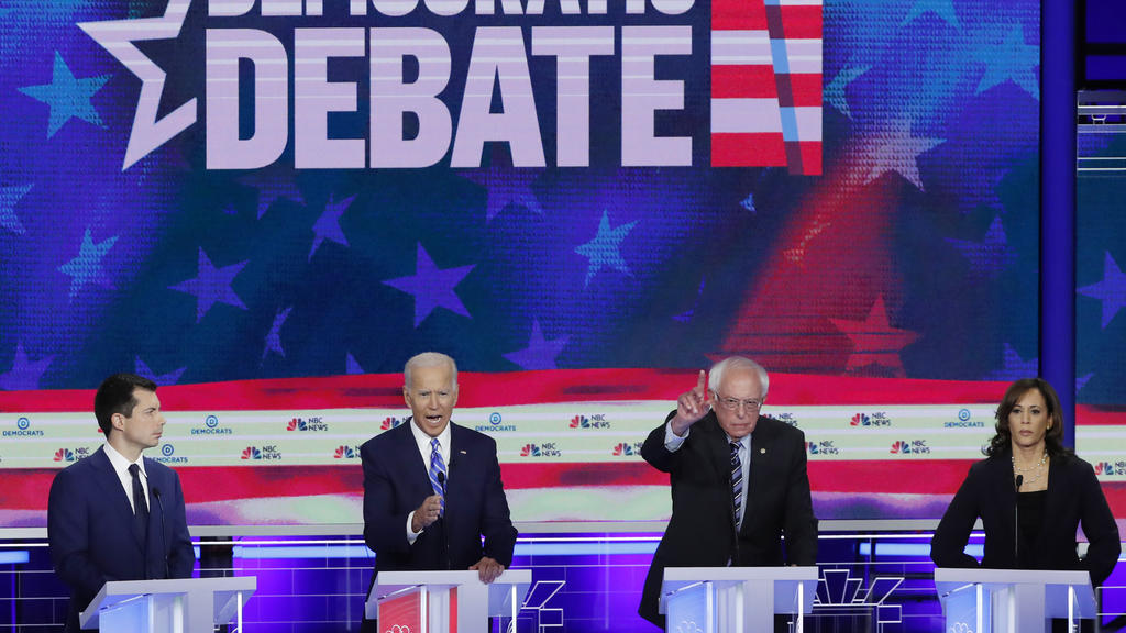 South Bend Mayor Pete Buttigieg, former Vice President Joe Biden, Senator Bernie Sanders and Senator Kamala Harris debate during the second night of the first Democratic presidential candidates debate in Miami, Florida, U.S. June 27, 2019. REUTERS/Mi