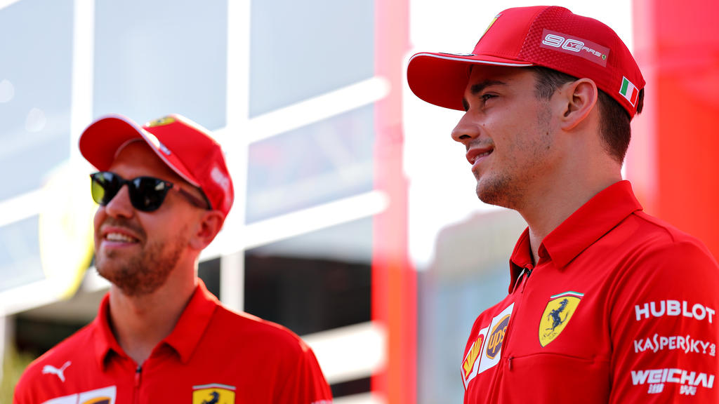 BUDAPEST, HUNGARY - AUGUST 01: Charles Leclerc of Monaco and Ferrari and Sebastian Vettel of Germany and Ferrari talk in the Paddock during previews ahead of the F1 Grand Prix of Hungary at Hungaroring on August 01, 2019 in Budapest, Hungary. (Photo