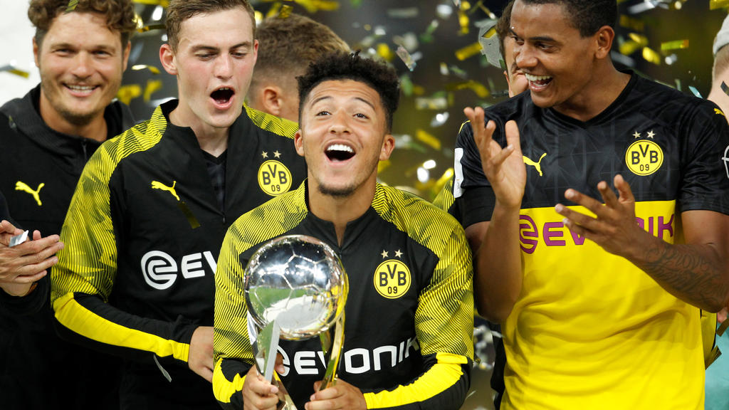 Soccer Football - German Super Cup - Borussia Dortmund v Bayern Munich - Signal Iduna Park, Dortmund, Germany - August 3, 2019 Borussia Dortmund's Jadon Sancho celebrates with the trophy after winning the German Super Cup REUTERS/Leon Kuegeler