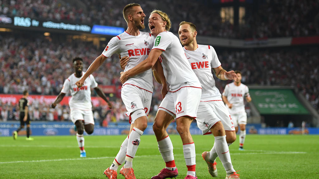 COLOGNE, GERMANY - AUGUST 23: Dominick Drexler of 1. FC Koeln (L) celebrates with his team mates after scoring his side's first goal during the Bundesliga match between 1. FC Koeln and Borussia Dortmund at RheinEnergieStadion on August 23, 2019 in C