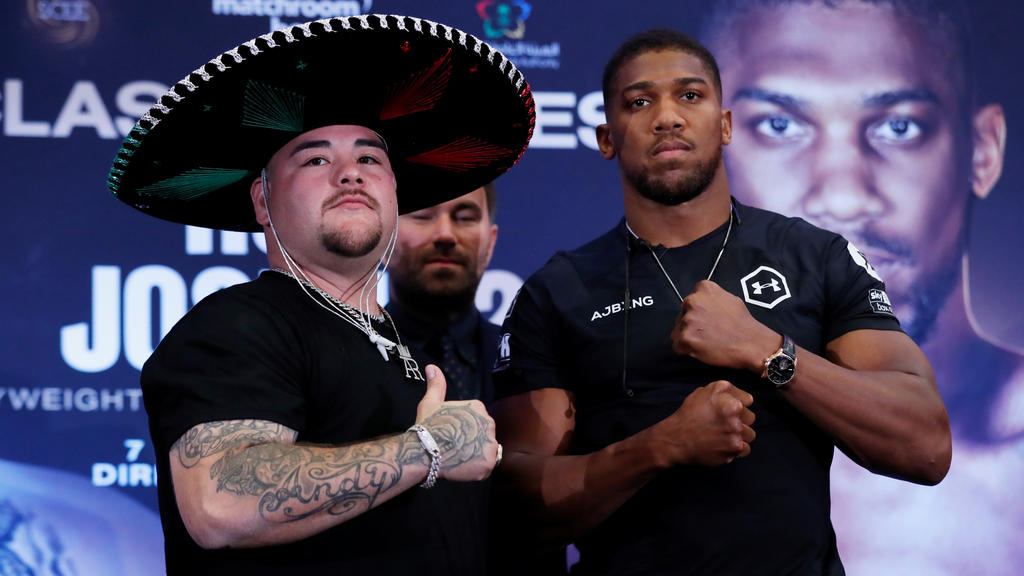 Boxing - Andy Ruiz Jr & Anthony Joshua Press Conference - Hilton London Syon Park, London, Britain - September 6, 2019 Andy Ruiz Jr and Anthony Joshua pose during the press conference as promoter Eddie hearn looks on Action Images via Reuters/Pet