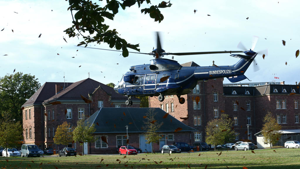 German special police escorts Stephan B., suspected of killing two people in a shooting in Halle October 9, 2019, as he arrives in a helicopter prior to a hearing at the Federal Court in Karlsruhe, Germany, October 10, 2019. REUTERS/Ralph Orlowski