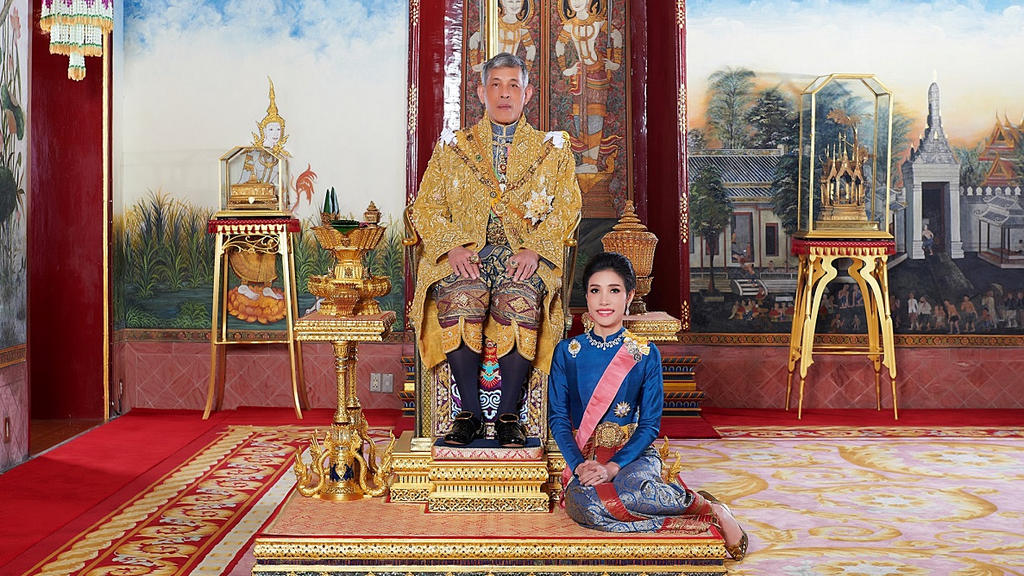 Thailand's King Maha Vajiralongkorn and General Sineenat Wongvajirapakdi, the royal consort pose at the Grand Palace in Bangkok, Thailand, in this undated handout photo obtained by Reuters August 27, 2019. Thailand's King Maha Vajiralongkorn has str