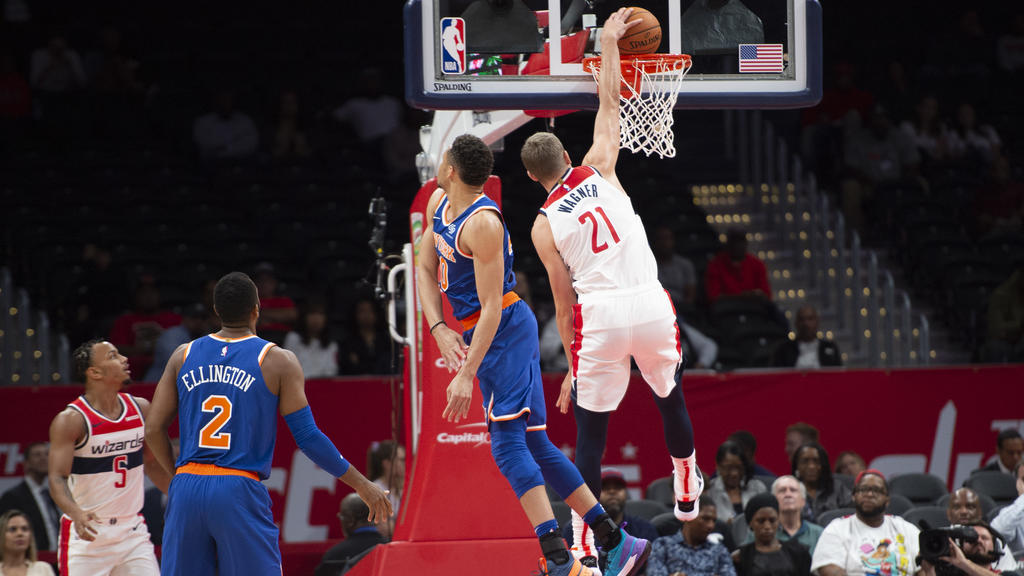 Oct 7, 2019; Washington, DC, USA; Washington Wizards guard Moritz Wagner (21) dunks as New York Knicks guard Kadeem Allen (0) defends during the first half at Capital One Arena. Mandatory Credit: Tommy Gilligan-USA TODAY Sports