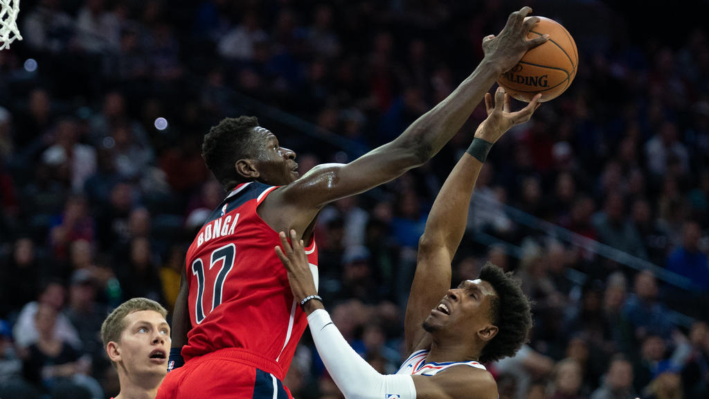 Oct 18, 2019; Philadelphia, PA, USA; Washington Wizards guard Isaac Bonga (17) blocks the shot of Philadelphia 76ers guard Josh Richardson (0) during the second quarter at Wells Fargo Center. Mandatory Credit: Bill Streicher-USA TODAY Sports