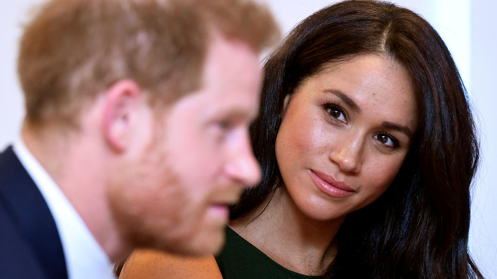 FILE PHOTO: Meghan, Duchess of Sussex, looks at Britain's Prince Harry during the WellChild Awards pre-Ceremony reception in London, Britain, October 15, 2019. REUTERS/Toby Melville/Pool/File Photo