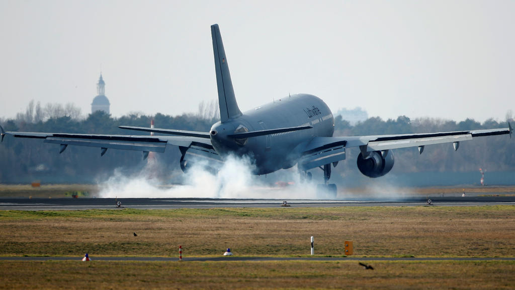 A group of 20 Germans evacuated from China's coronavirus epicentre Wuhan arrive with a German air force plane in Berlin Tegel, Germany, February 9, 2020. REUTERS/Hannibal Hanschke
