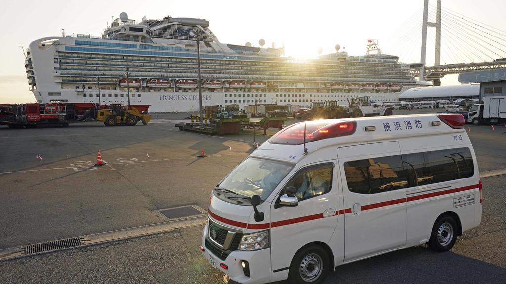 New coronavirus An ambulance moves away from the cruise ship Diamond Princess docked in Yokohama near Tokyo on Feb. 11, 2020. The vessel has been kept in quarantine after the detection of a new coronavirus infection among people aboard. PUBLICATIONx