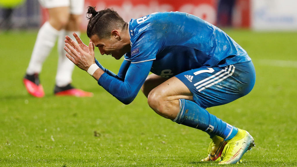 Soccer Football - Champions League - Round of 16 First Leg - Olympique Lyonnais v Juventus - Groupama Stadium, Lyon, France - February 26, 2020 Juventus' Cristiano Ronaldo reacts on the ground REUTERS/Eric Gaillard