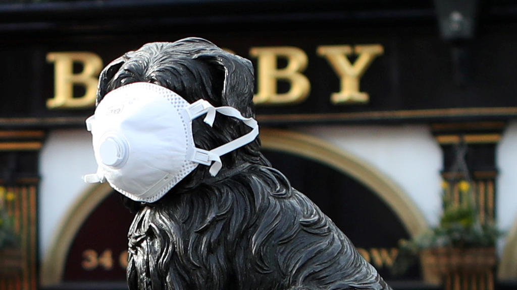 The Greyfriars Bobby statue is pictured wearing a mask as the spread of the coronavirus disease (COVID-19) continues, in Edinburgh, Scotland, Britain, March 23, 2020. REUTERS/Russell Cheyne