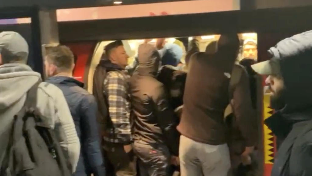 People get into a crowded underground train at North Greenwich Station, as the spread of the coronavirus disease (COVID-19) continues, in London, Britain March 23, 2020, in this still image obtained from a social media video. Peter Fellows/via REUTER