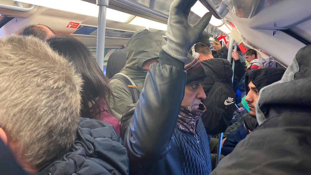 People ride on a crowded underground train, as the spread of the coronavirus disease (COVID-19) continues, in London, Britain March 23, 2020, in this picture obtained from social media. Peter Fellows/via REUTERS NO RESALES. NO ARCHIVES. THIS IMAGE