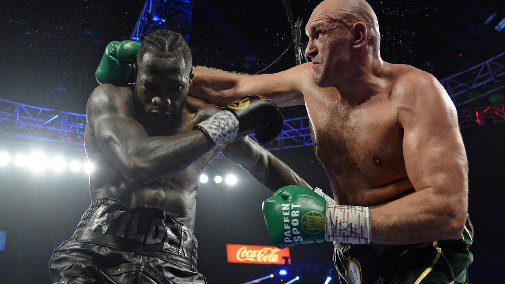 FILE PHOTO: Feb 22, 2020; Las Vegas, Nevada, USA; Deontay Wilder and Tyson Fury box during their WBC heavyweight title bout at MGM Grand Garden Arena. Fury won via seventh round TKO. Mandatory Credit: Joe Camporeale-USA TODAY Sports/File Photo