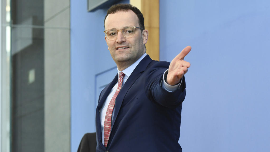 German Health Minister Jens Spahn arrives for a news conference about the spread of coronavirus disease in Berlin, Germany, Thursday, March 26, 2020. The new coronavirus causes mild or moderate symptoms for most people, but for some, especially older