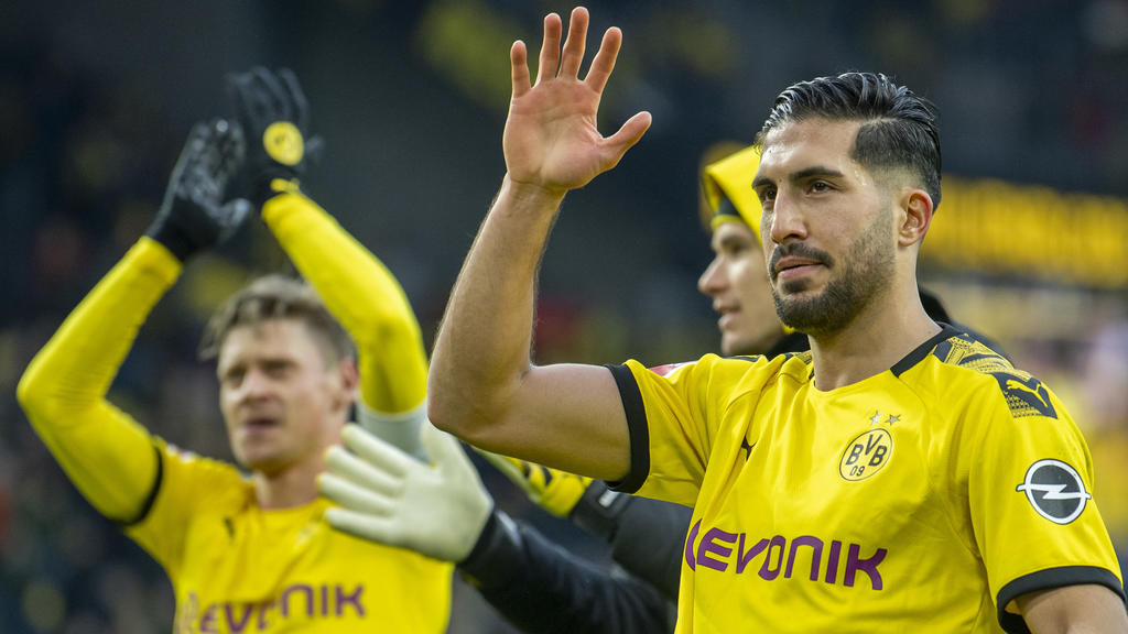 ARCHIV - 29.02.2020, Nordrhein-Westfalen, Dortmund: Fußball: Bundesliga, Borussia Dortmund - SC Freiburg, 24. Spieltag, im Signal-Iduna-Park. Nach dem Schlusspfiff jubelt Dortmunds Emre Can (r) vor der Südtribüne. (zu dpa «BVB trainiert ab Montag in