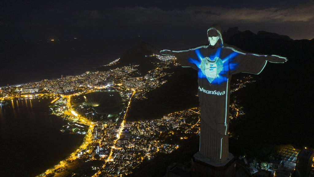 May 4, 2020, Brazil, Rio de Janeiro: the statue of the Christ the Redeemer in Rio is illuminated as if wearing a face mask. 