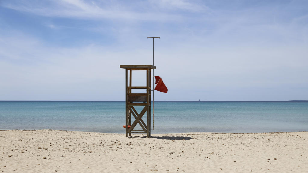 May 7, 2020, Spain, Palma: A red flag flies on the Arenal beach to prohibit swimming. The absence of tourists can be felt on the beaches of Mallorca. 