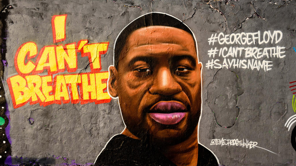 People can be seen in front of a graffiti by the artist Eme Freethinker with the writing ''I can't breathe'' and the portrait of George Floyd can be seen in Berlin Mauerpark days after the death of George Floyd, an African-American man from Minnesota