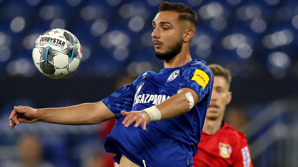 GELSENKIRCHEN, GERMANY - JUNE 14: Ahmed Kutucu sof Schalke stops the ball during the Bundesliga match between FC Schalke 04 and Bayer 04 Leverkusen at Veltins-Arena on June 14, 2020 in Gelsenkirchen, Germany. (Photo by Lars Baron/Getty Images)