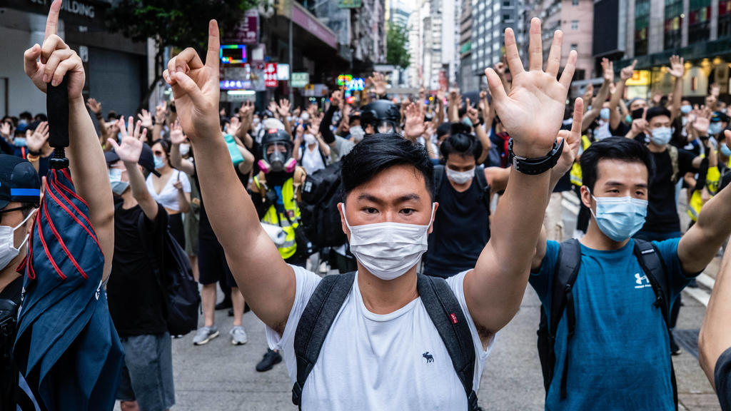 July 1, 2020, Hong Kong, China: Protesters making gestures of 1 and 5 fingers, symbolising the five demands of the protest movement during the demonstration..Following the passing of the National Security Law that would tighten on freedom of expressi