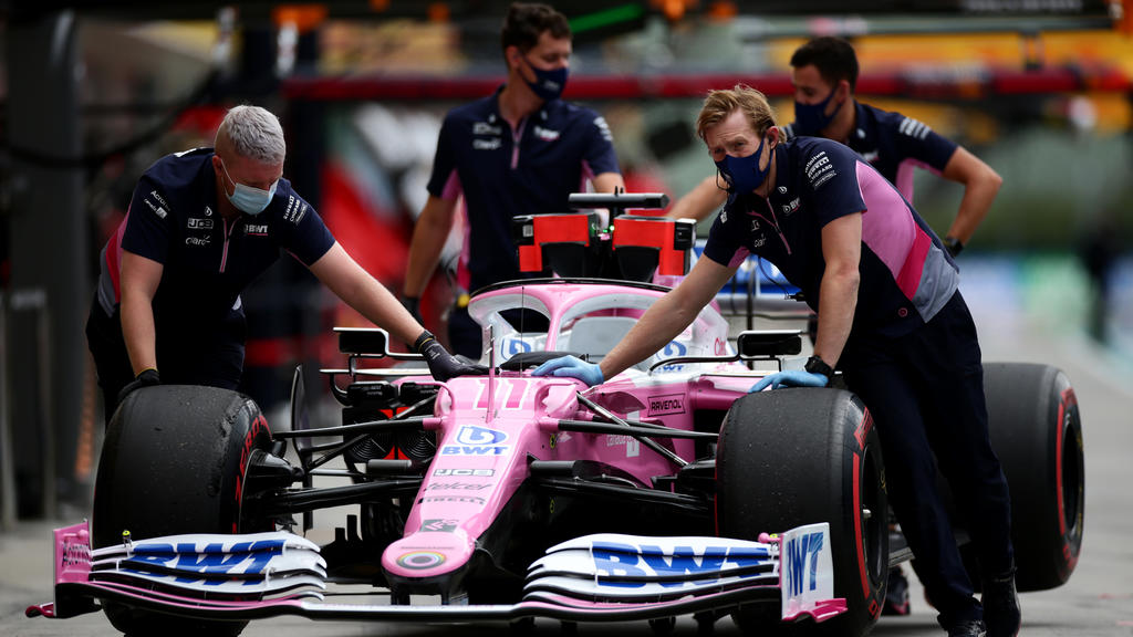 BUDAPEST, HUNGARY - JULY 18: Racing Point team members push Sergio Perez of Mexico and Racing Point car back into the garage during final practice for the F1 Grand Prix of Hungary at Hungaroring on July 18, 2020 in Budapest, Hungary. (Photo by Peter