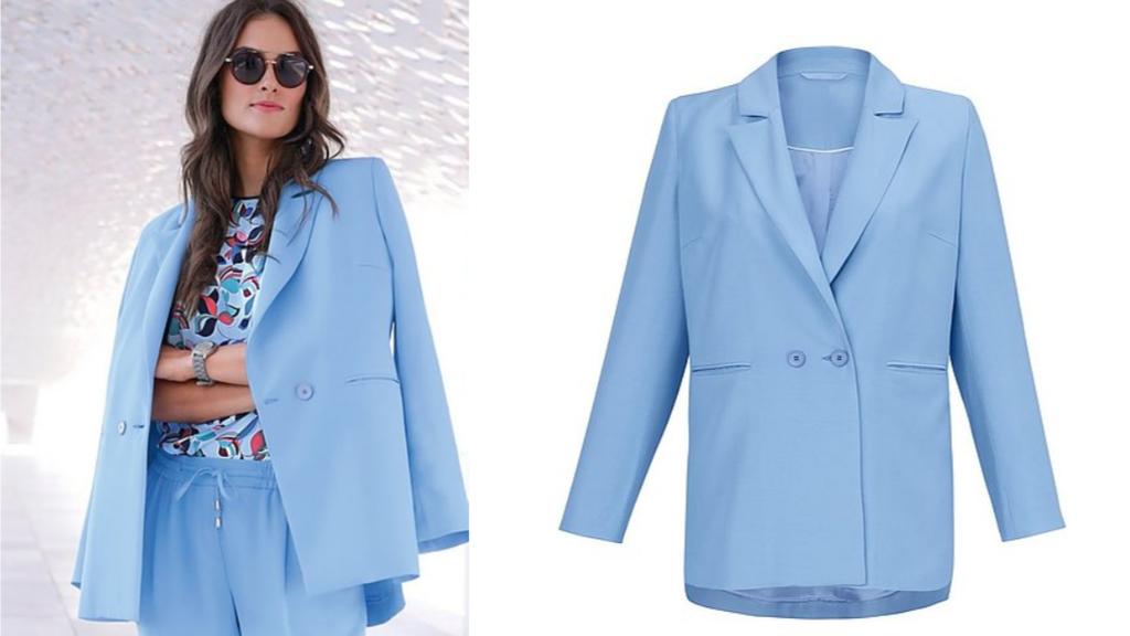 Frau trägt einen hellblauen Blazer.