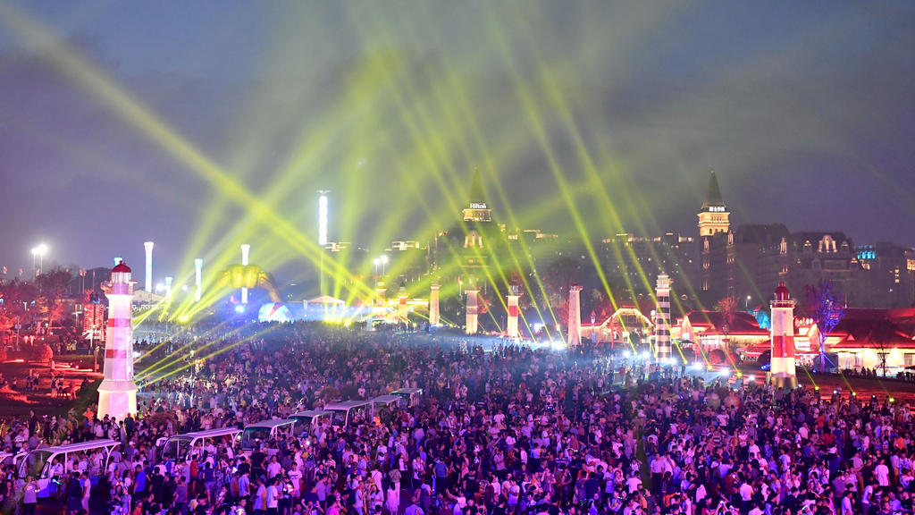 Holidaymakers attend the 28th Qingdao International Beer Festival (Asian Oktoberfest) at the Wanren Square of Golden Sands Beach in Qingdao city, east China's Shandong province, 20 July 2018. The 28th Qingdao International Beer Festival, one of the l