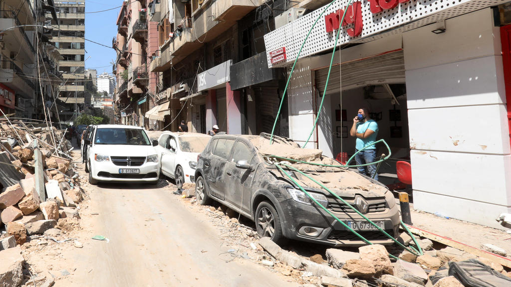 Lebanese inspect the damage of a massive explosion in Lebanon s capital Beirut, on Wednesday, on August 5, 2020. Rescuers worked through the night after two enormous explosions ripped through Beirut s port on August 4th, killing at least 100 people a