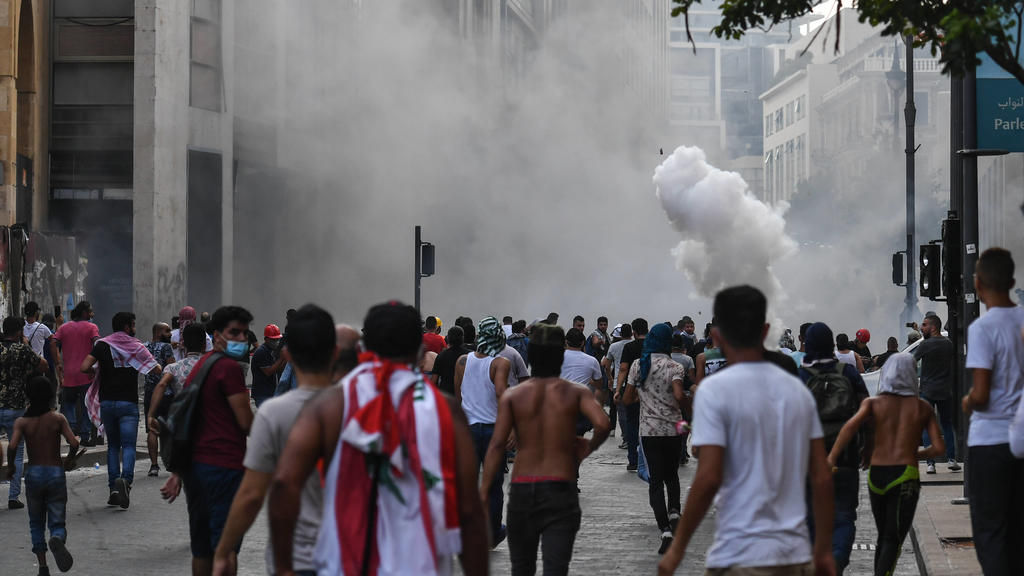 BEIRUT, LEBANON - AUGUST 8, 2020: People take part in a protest on a city street, demanding the resignation of the government led by Prime Minister Hassan Diab and early parliamentary election. The August 4 explosion in the port area of Beirut resul