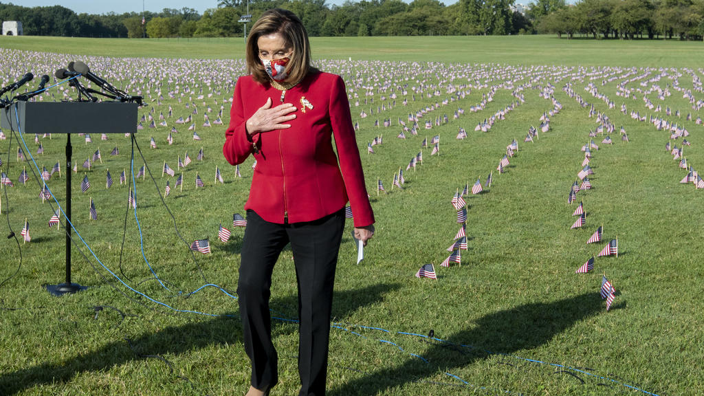 House Speaker Nancy Pelosi takes part during an event commemorating the 200,000 Americans that have lost their lives due to the Covid-19 pandemic, on the National Mall in Washington, DC on Tuesday, September 22, 2020. Some 20,000 American flags were