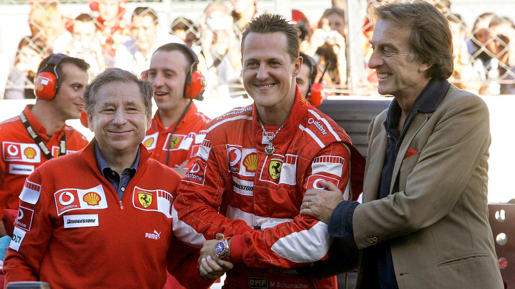 FILE - German Formula One driver Michael Schumacher (C) stands amidst managing director of Ferrari Jean Todt (L) and team's president Luca Cordero di Montezemolo in Monza on Sunday 29 October 2006 during the Ferrari Days, the traditional event organi