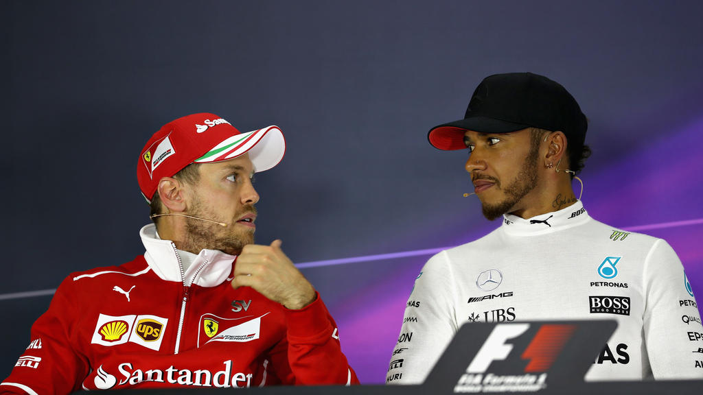 SHANGHAI, CHINA - APRIL 09: Race winner Lewis Hamilton of Great Britain and Mercedes GP talks with second placed finisher Sebastian Vettel of Germany and Ferrari in the post race press conference during the Formula One Grand Prix of China at Shangha