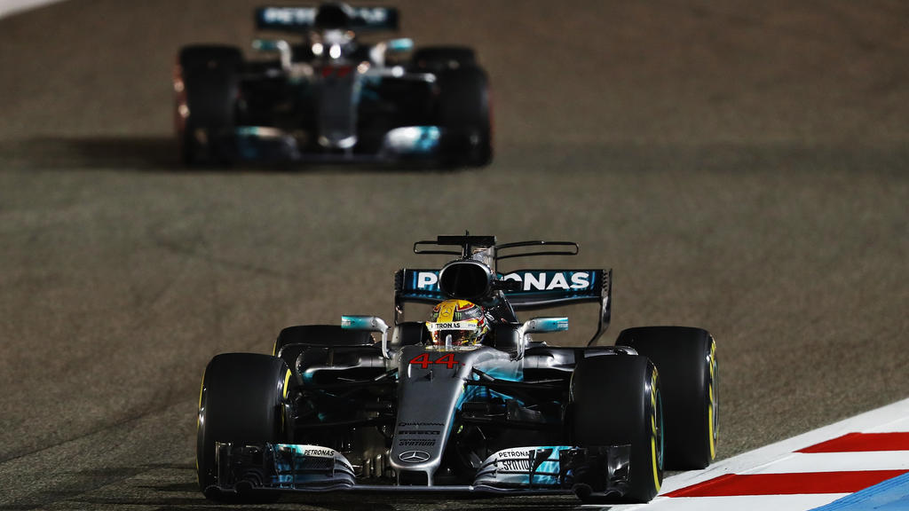 BAHRAIN, BAHRAIN - APRIL 16: Lewis Hamilton of Great Britain driving the (44) Mercedes AMG Petronas F1 Team Mercedes F1 WO8 leads Valtteri Bottas driving the (77) Mercedes AMG Petronas F1 Team Mercedes F1 WO8 on track during the Bahrain Formula One G