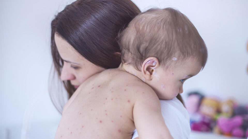 Mother nursing sick child At Home