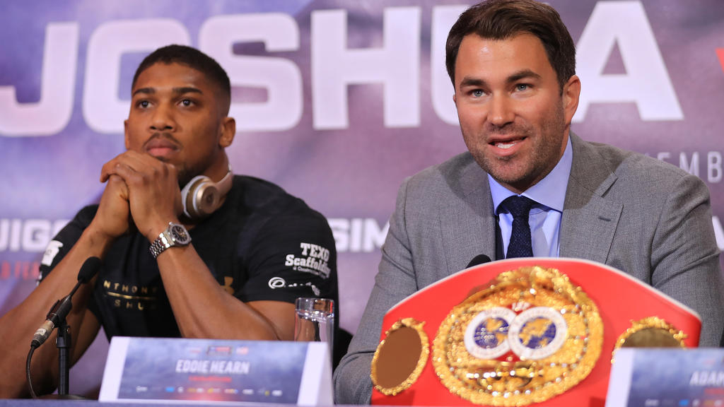 LONDON, ENGLAND - APRIL 27: Eddie Hearn, boxing promoter (R) and Anthony Joshua (L) speak during a press conference for his Super Heavyweight title fight against Wladamir Klitschko at Sky Sports Studios on April 27, 2017 in London, England. Anthony