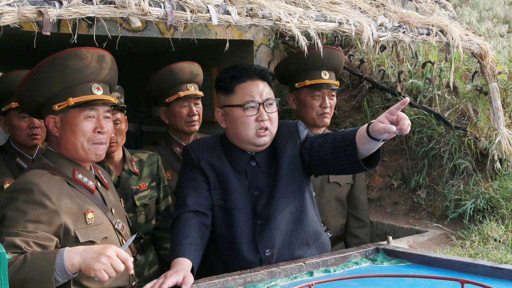 North Korean leader Kim Jong Un inspects the defence detachment on Jangjae Islet and the Hero Defence Detachment on Mu Islet located in the southernmost part of the waters off the southwest front, in this undated photo released by North Korea's Korea