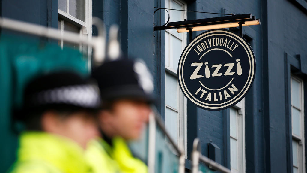 Police officers stand on duty outside a restaurant which has been secured as part of the investigation into the poisoning of former Russian inteligence agent Sergei Skripal and his daughter Yulia, in Salisbury, Britain March 11, 2018. REUTERS/Henry N