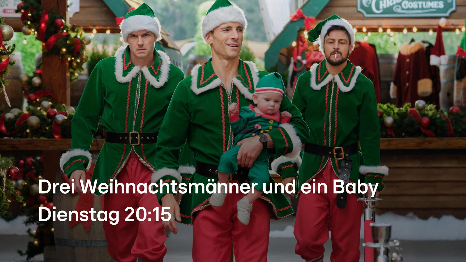 Drei Weihnachtsmänner und ein Baby